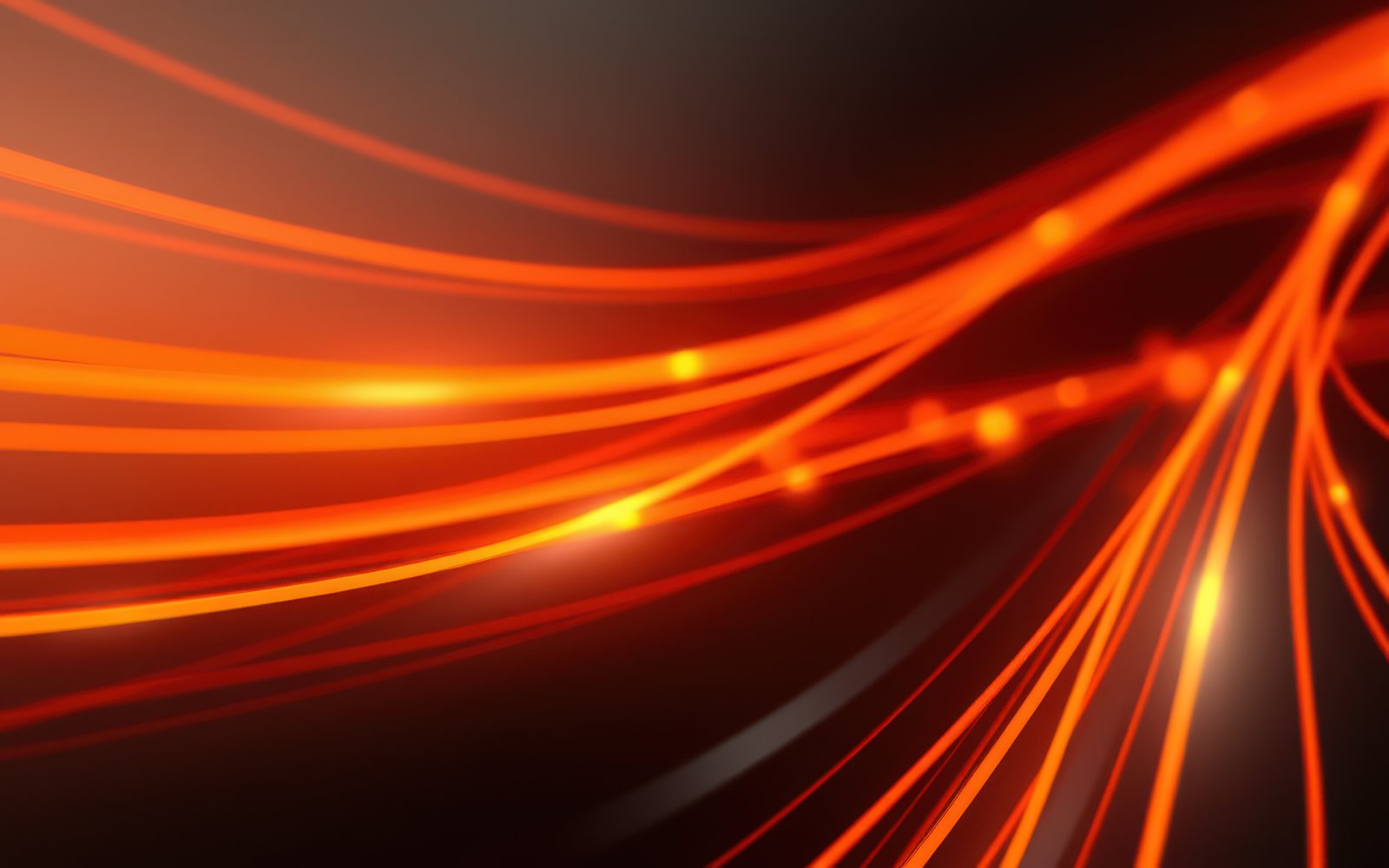 Dynamic red and orange light patterns create a mesmerizing visual display during a nighttime event